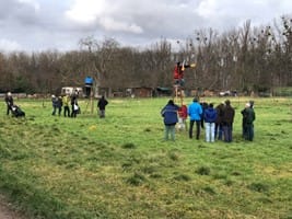a group of people standing in a field